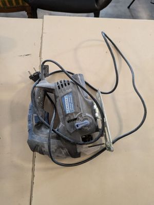 a picture of a corded sander sitting on a table