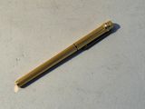 a pen that is laying on top of a table