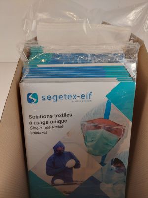 a box of surgical masks in it on a table