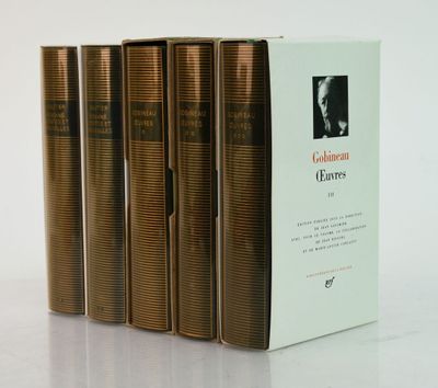 three books are stacked on top of each other on a table