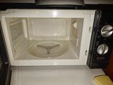 a microwave with a lid on it sitting on a counter