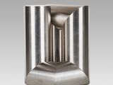 a close up of a metal object on a white background