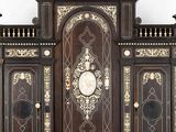 a large wooden cabinet with a clock on top of it