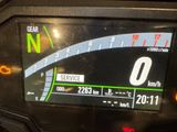 a close up of a motorcycle dashboard with a speedometer