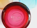 a close up of a bottle with a lid on a table