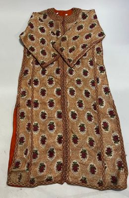 a brown and red dress with a flower pattern on it