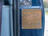 a plaque on the side of a blue bus