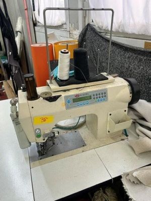 a sewing machine sitting on a table in a room