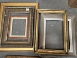 four different picture frames on the floor next to each other