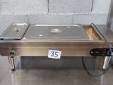 an image of a stainless steel food warmer with a price tag on it