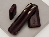 a pen and a pencil case on a table