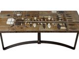 a table with a mosaic tile top and metal legs