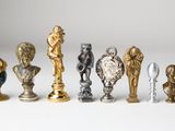 many different types of figurines on a white surface