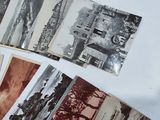 many old photos of a city on a table