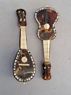 two pieces of musical instruments sitting on top of a table