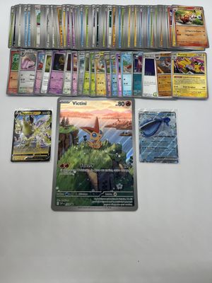 pokemon trading card game on a table with a lot of cards on it