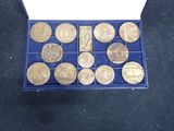 a box of coins that are sitting on a table