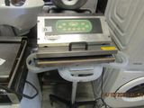 a machine that is sitting next to a washing machine