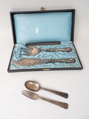 a silverware set in a box with a spoon and fork