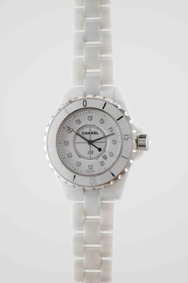 an image of a close up of a wrist watch on a white background