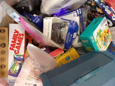 a pile of toys and other items that are in a bin