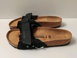 paire de sandales noires pour femme, ornées d'un nœud noir sur le côté