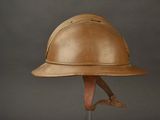 a helmet on a stand on a gray background