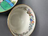 a small bowl and a small bowl sitting on a table