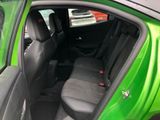 a green car with black seats in the back of it