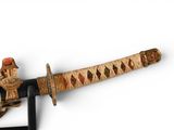 an image of a sword with a wooden handle
