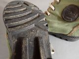 a close up of a pair of shoes with a rubber sole