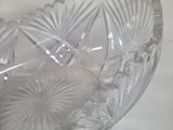 a clear glass bowl with a flower design on it