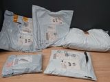three bags of food sitting on a table next to each other