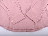 a close up of a pink shirt on a white background