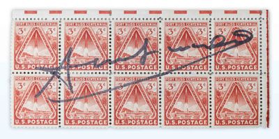 a close up of a stamp with a signature on it