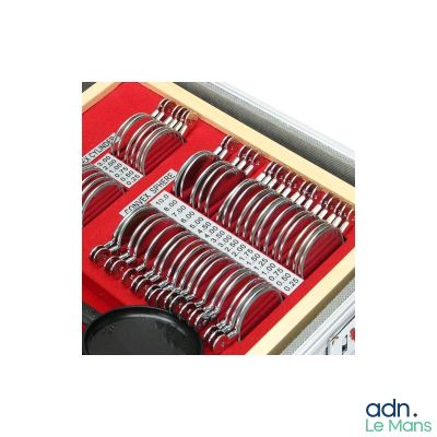 many pairs of scissors in a box with red cloth