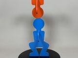 an orange and blue object on top of a black plate