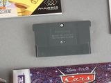 a nintendo game on the table next to some other items