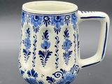an image of a blue and white coffee mug on a table
