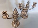 a silver candelab that is sitting on a table