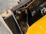 a close up of a yellow bulldozer on the ground