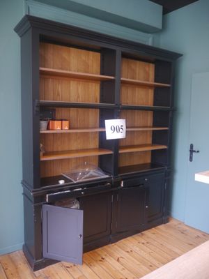 an image of a black bookcase in a living room
