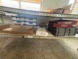 a shelf with boxes and boxes on it in a store