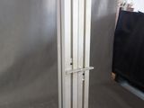 a large refrigerator that is in the corner of a room