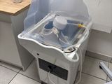 a sink with a plastic cover on it in a bathroom