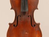 an old violin with a bow hanging from it ' s back