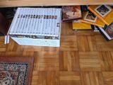a lot of books that are sitting on the floor