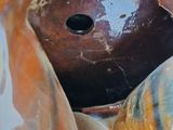 an image of a close up of a vase with a hole in it