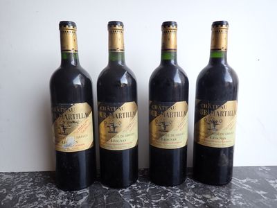 three bottles of wine sitting on top of a table next to each other