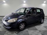 a picture of a small blue car parked in a garage